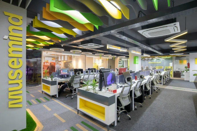 a large open office space with desks and computers